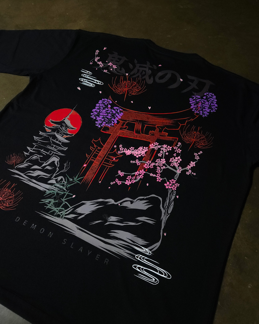 Anime-inspired apparel featuring bold back artwork, worn by a model in a dark studio setting – from a South African anime clothing brand.