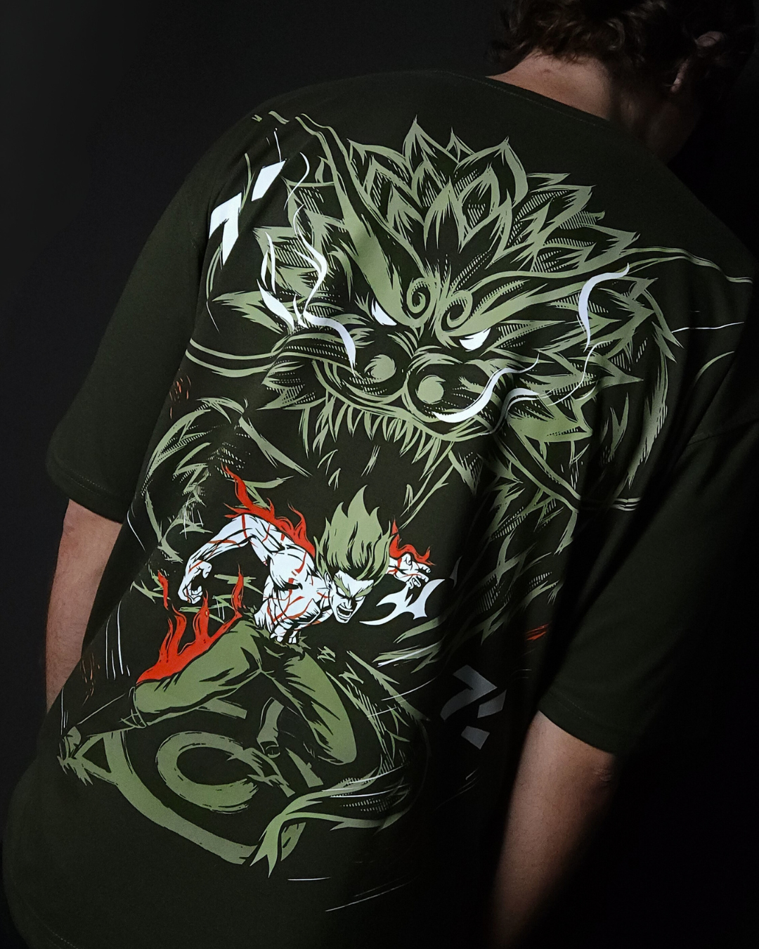 Anime-inspired apparel featuring bold Naruto back artwork, worn by a model in a dark studio setting – from a South African anime clothing brand.