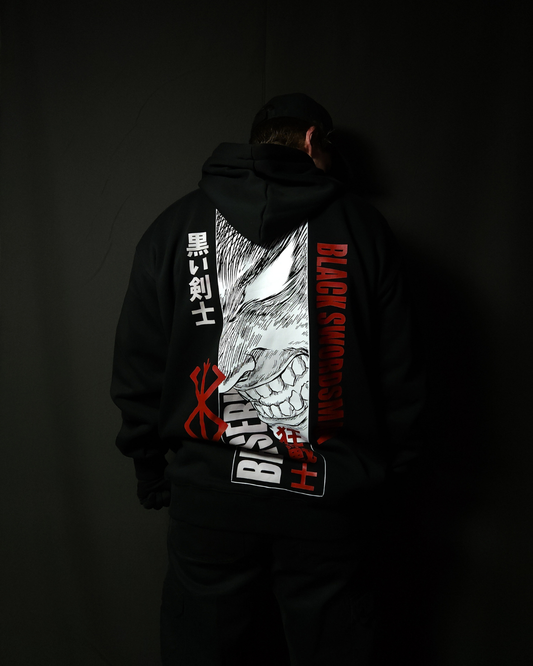 Anime-inspired apparel featuring bold back artwork, worn by a model in a dark studio setting – from a South African anime clothing brand.