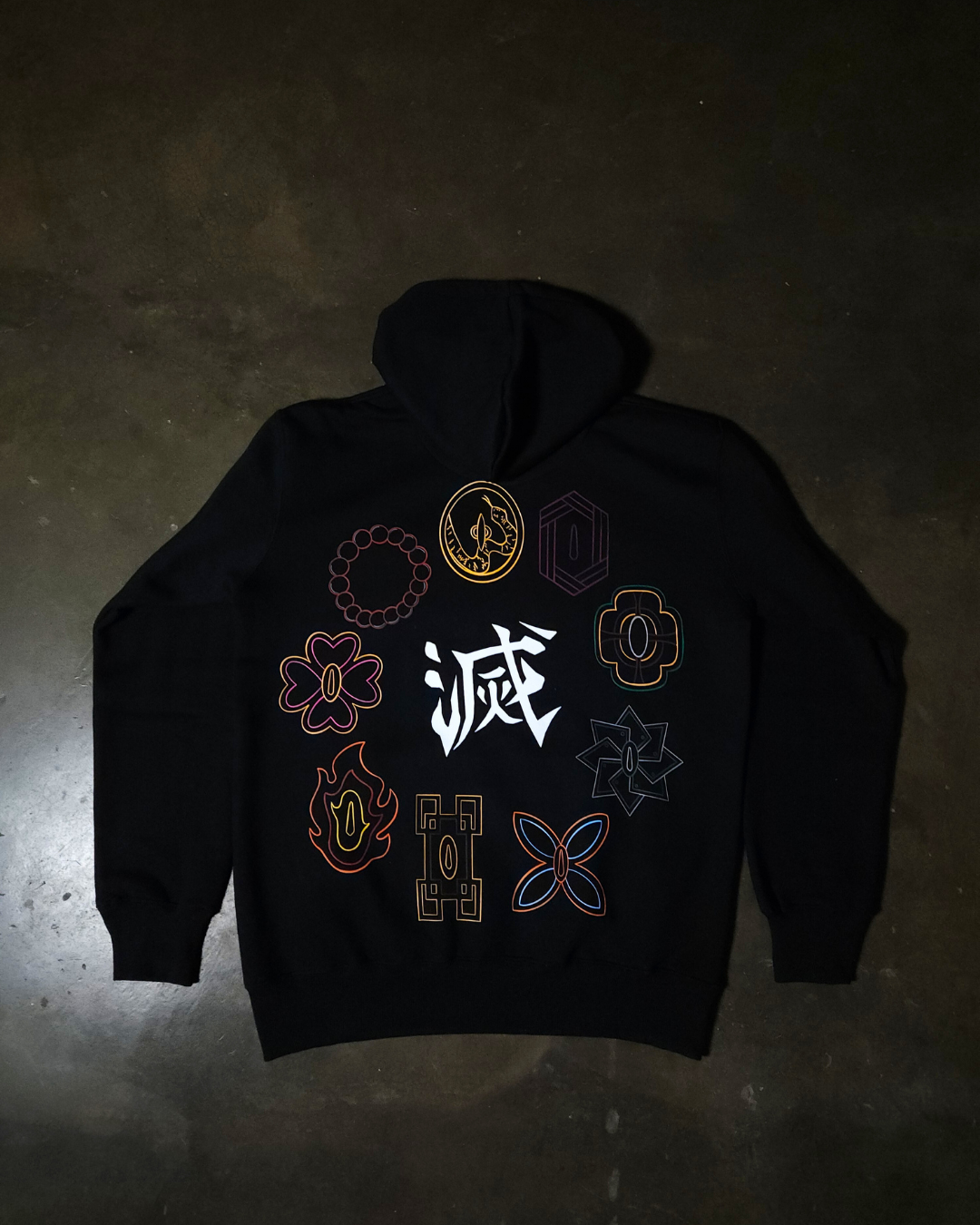 Anime-inspired apparel featuring bold back artwork, worn by a model in a dark studio setting – from a South African anime clothing brand.