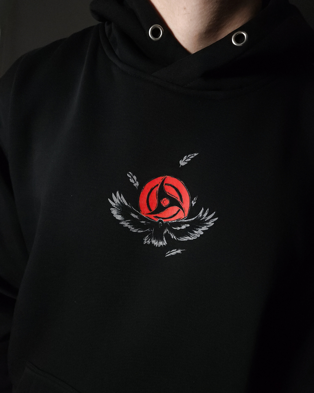 Anime-inspired apparel featuring bold back artwork, worn by a model in a dark studio setting – from a South African anime clothing brand.