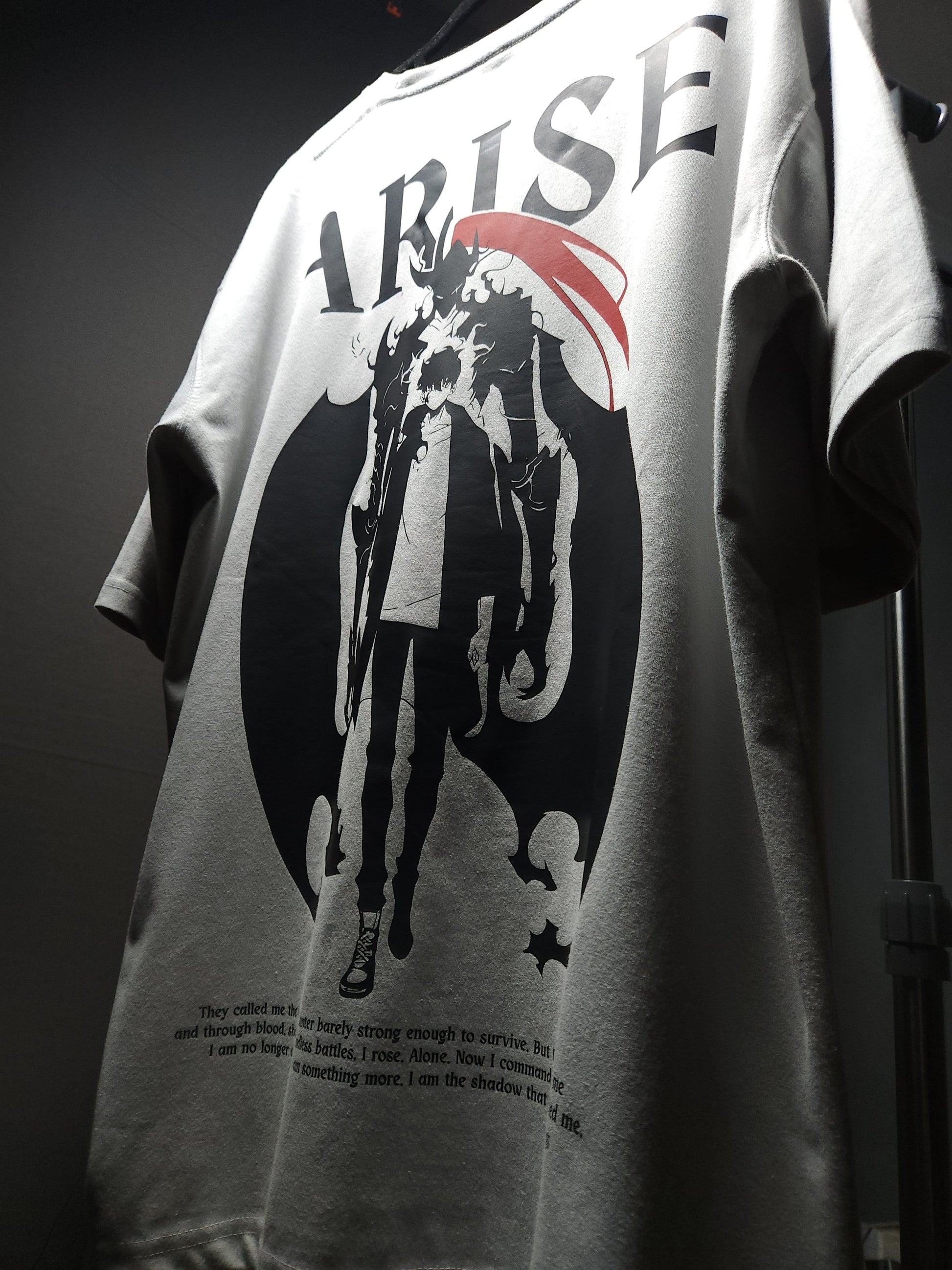 Anime-inspired apparel featuring bold back artwork, worn by a model in a dark studio setting – from a South African anime clothing brand.