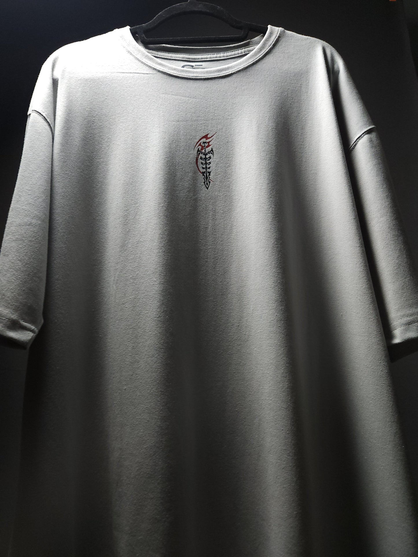 Anime-inspired apparel featuring bold back artwork, worn by a model in a dark studio setting – from a South African anime clothing brand.