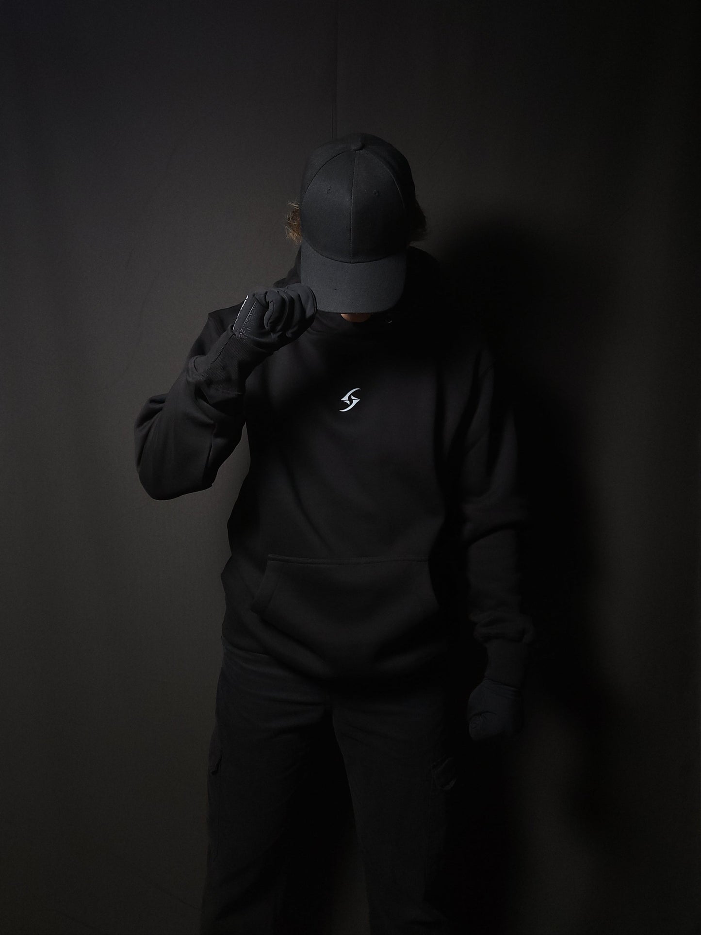 Anime-inspired apparel featuring bold back artwork, worn by a model in a dark studio setting – from a South African anime clothing brand.