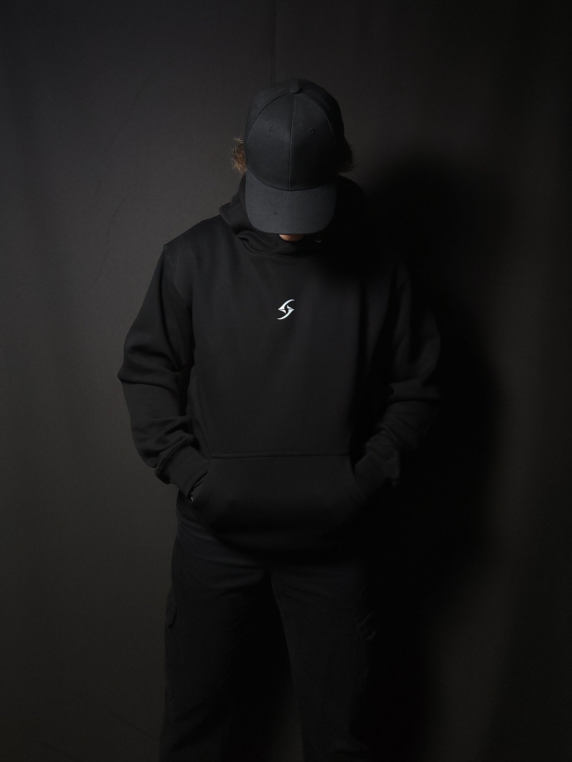 Anime-inspired apparel featuring bold back artwork, worn by a model in a dark studio setting – from a South African anime clothing brand.