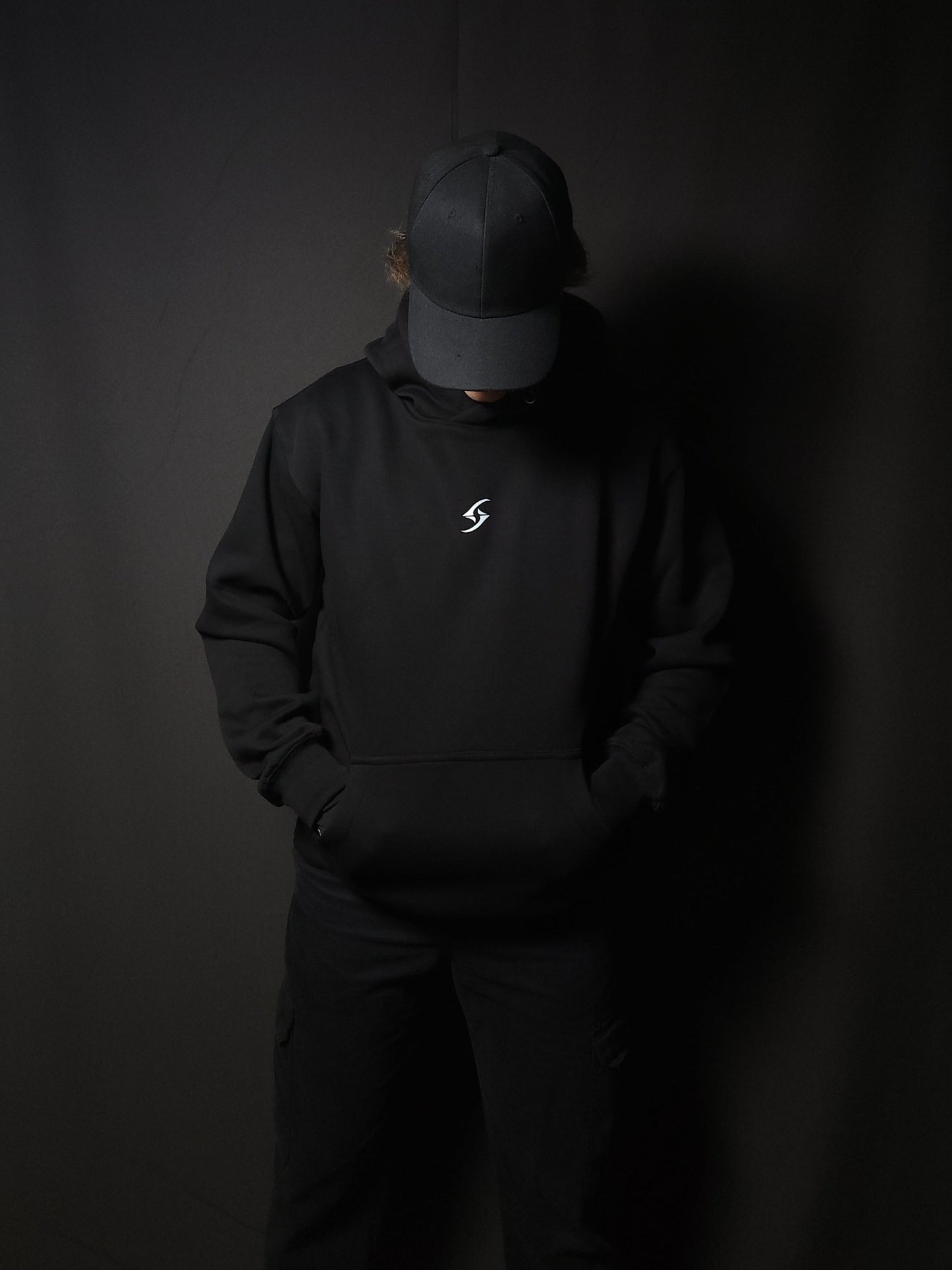 Anime-inspired apparel featuring bold back artwork, worn by a model in a dark studio setting – from a South African anime clothing brand.