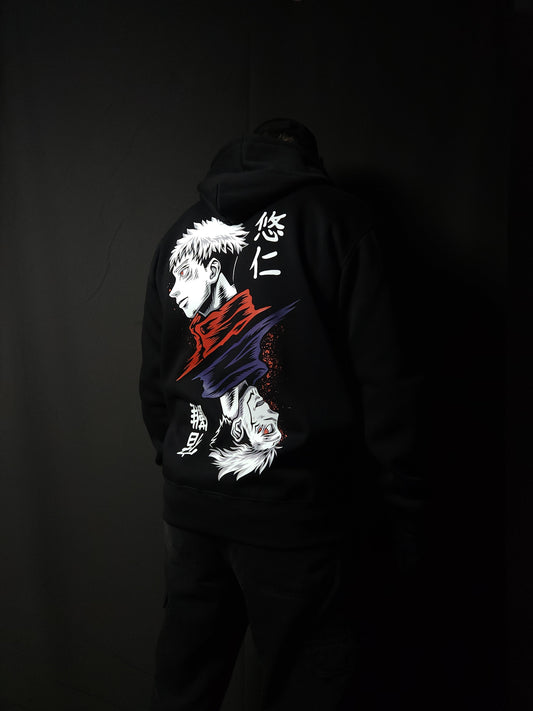 Anime-inspired apparel featuring bold back artwork, worn by a model in a dark studio setting – from a South African anime clothing brand.