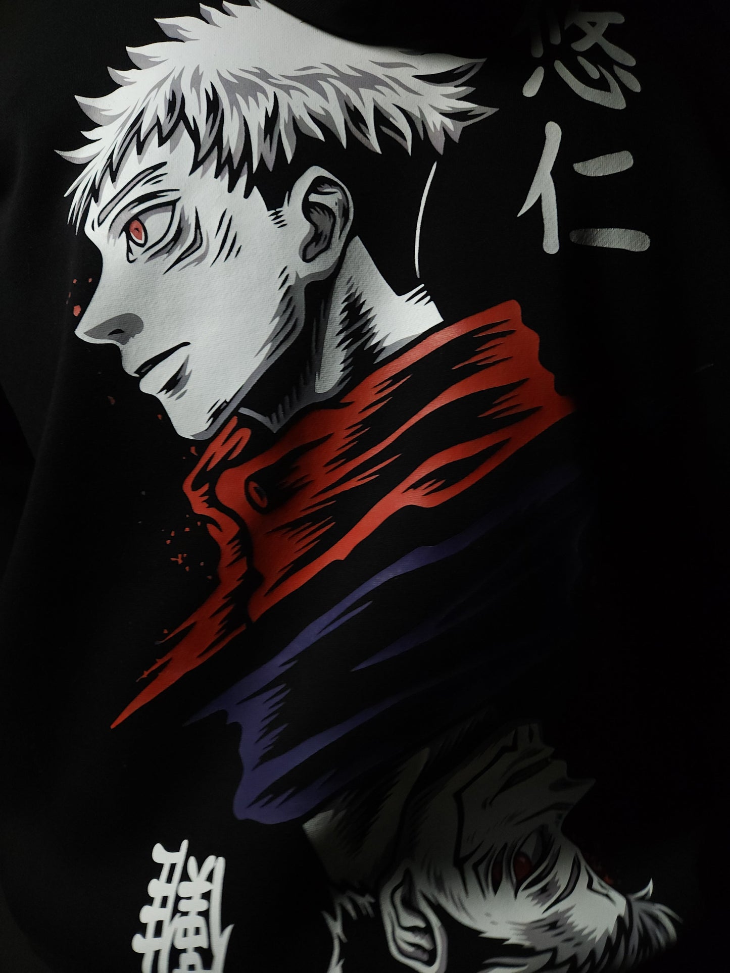 Anime-inspired apparel featuring bold back artwork, worn by a model in a dark studio setting – from a South African anime clothing brand.