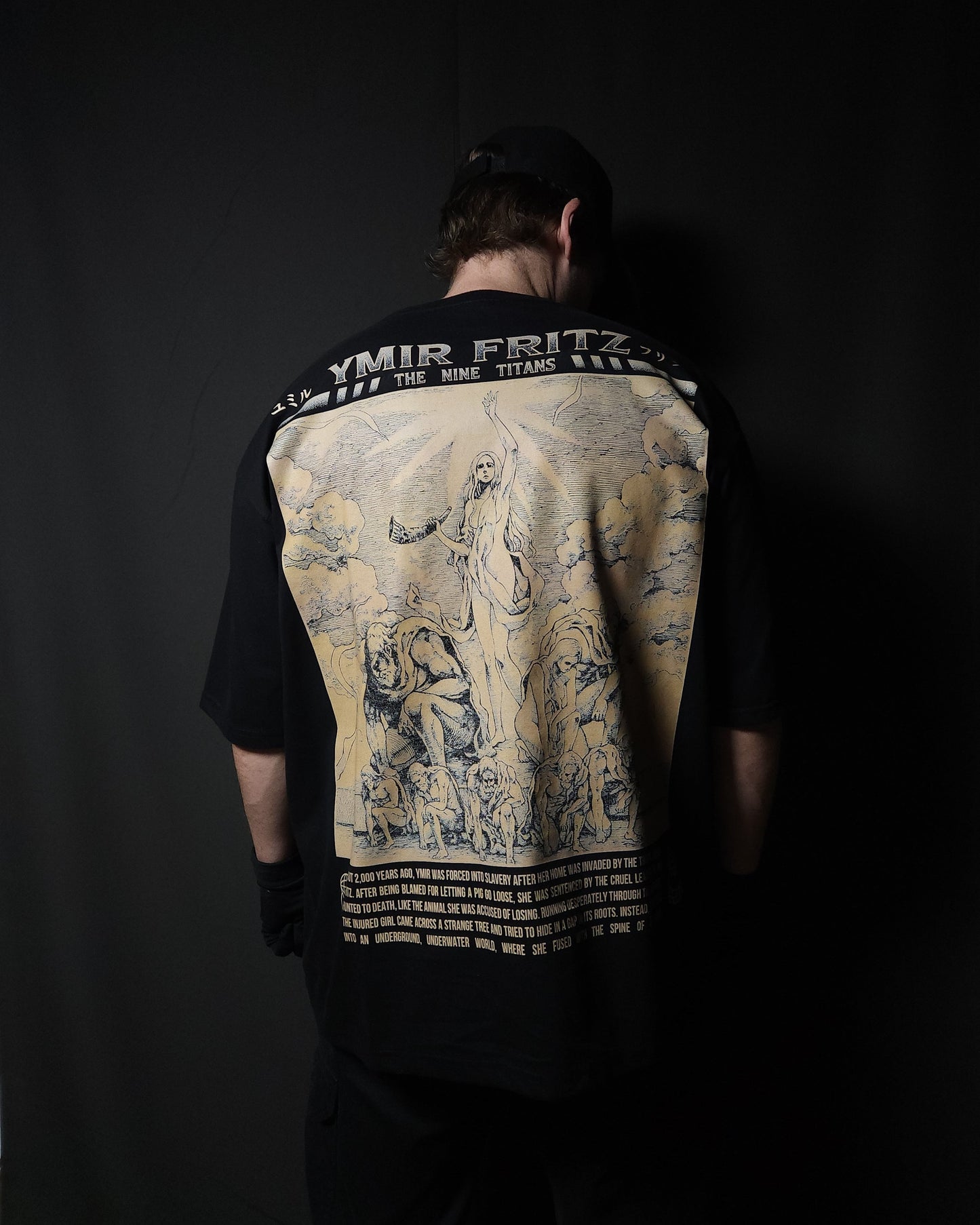 Anime-inspired apparel featuring bold back artwork, worn by a model in a dark studio setting – from a South African anime clothing brand.