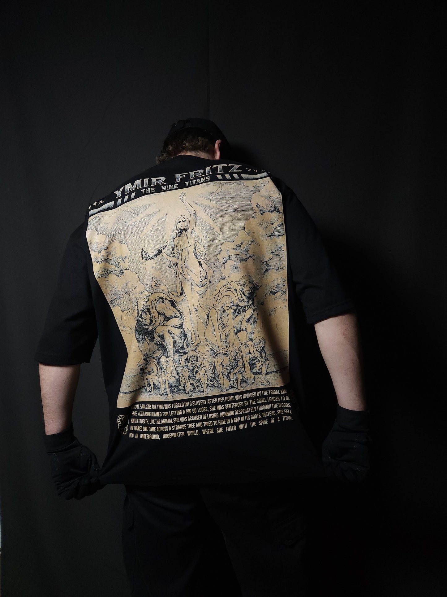 Anime-inspired apparel featuring bold back artwork, worn by a model in a dark studio setting – from a South African anime clothing brand.