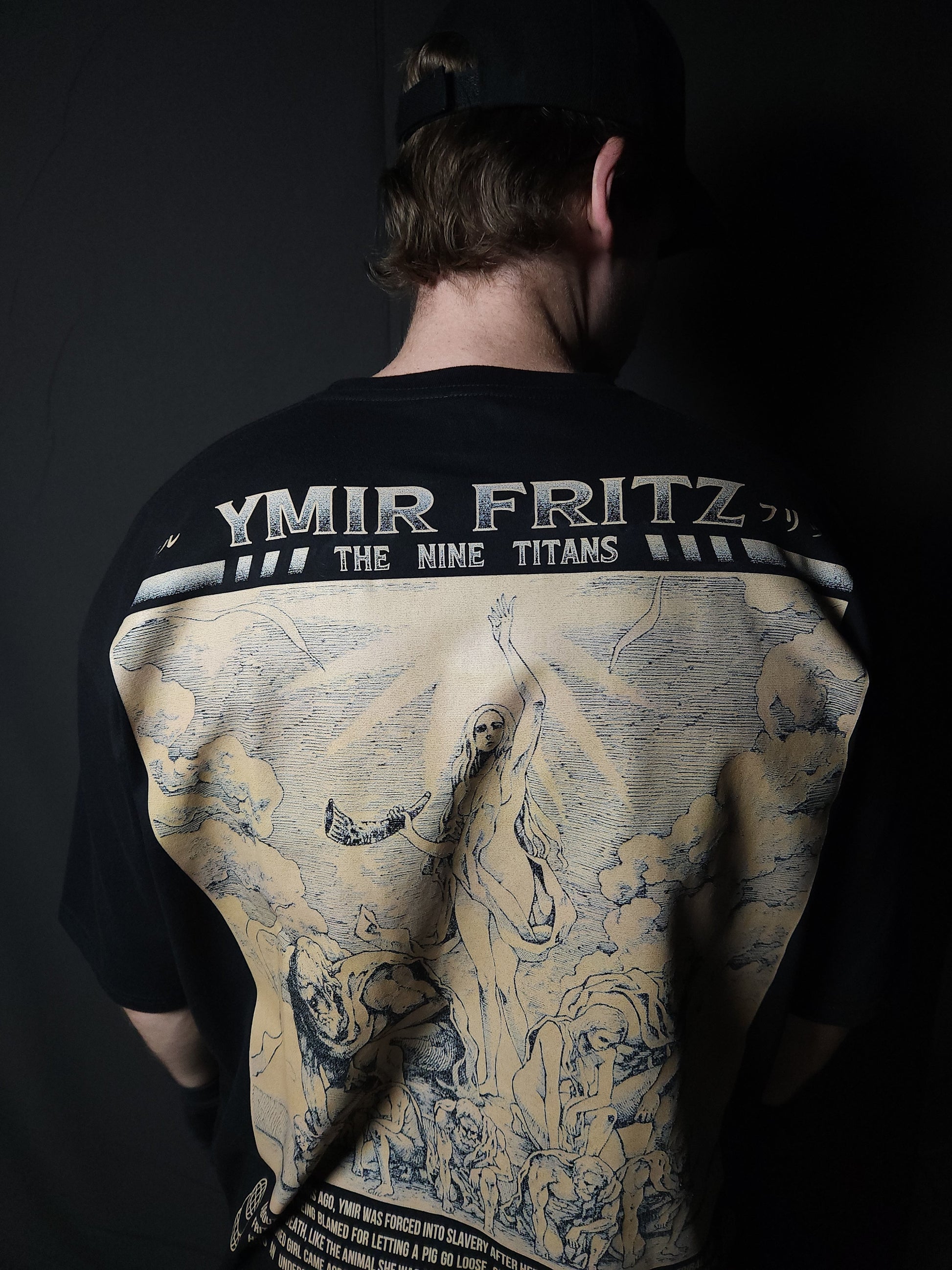 Anime-inspired apparel featuring bold back artwork, worn by a model in a dark studio setting – from a South African anime clothing brand.