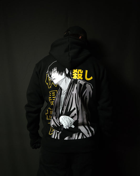 Anime-inspired apparel featuring bold back artwork, worn by a model in a dark studio setting – from a South African anime clothing brand.