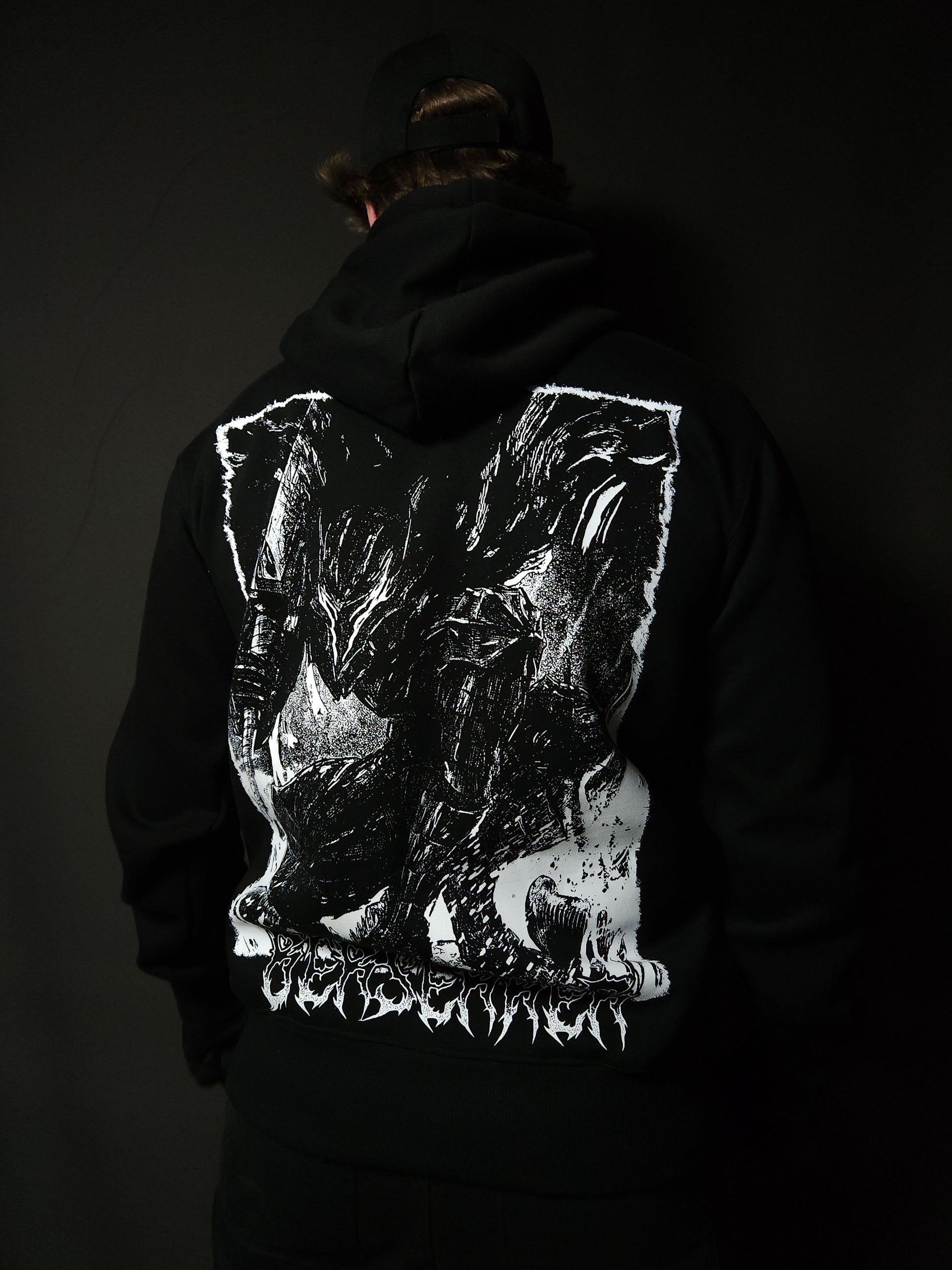 Anime-inspired apparel featuring bold back artwork, worn by a model in a dark studio setting – from a South African anime clothing brand.