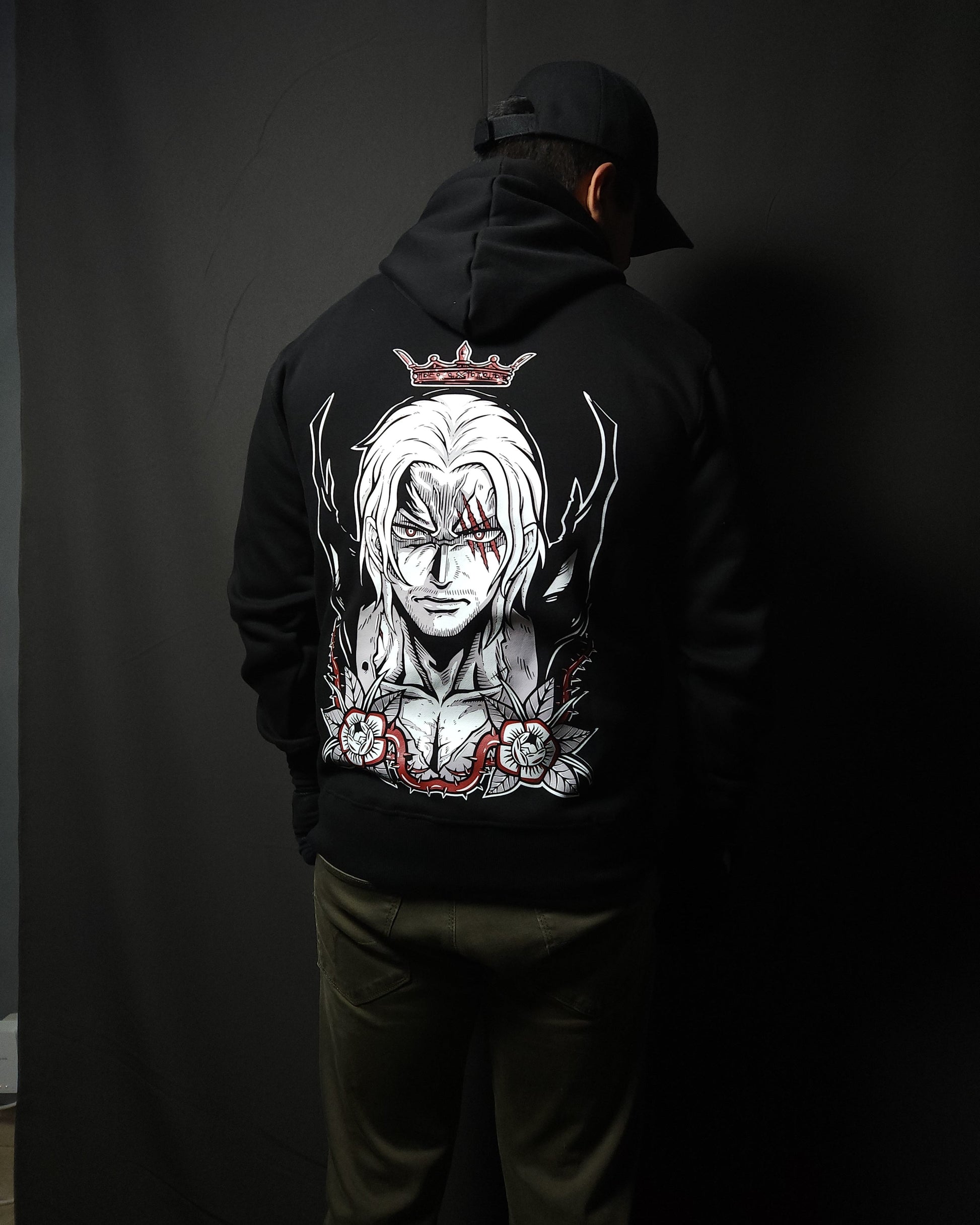 Anime-inspired apparel featuring bold back artwork, worn by a model in a dark studio setting – from a South African anime clothing brand.