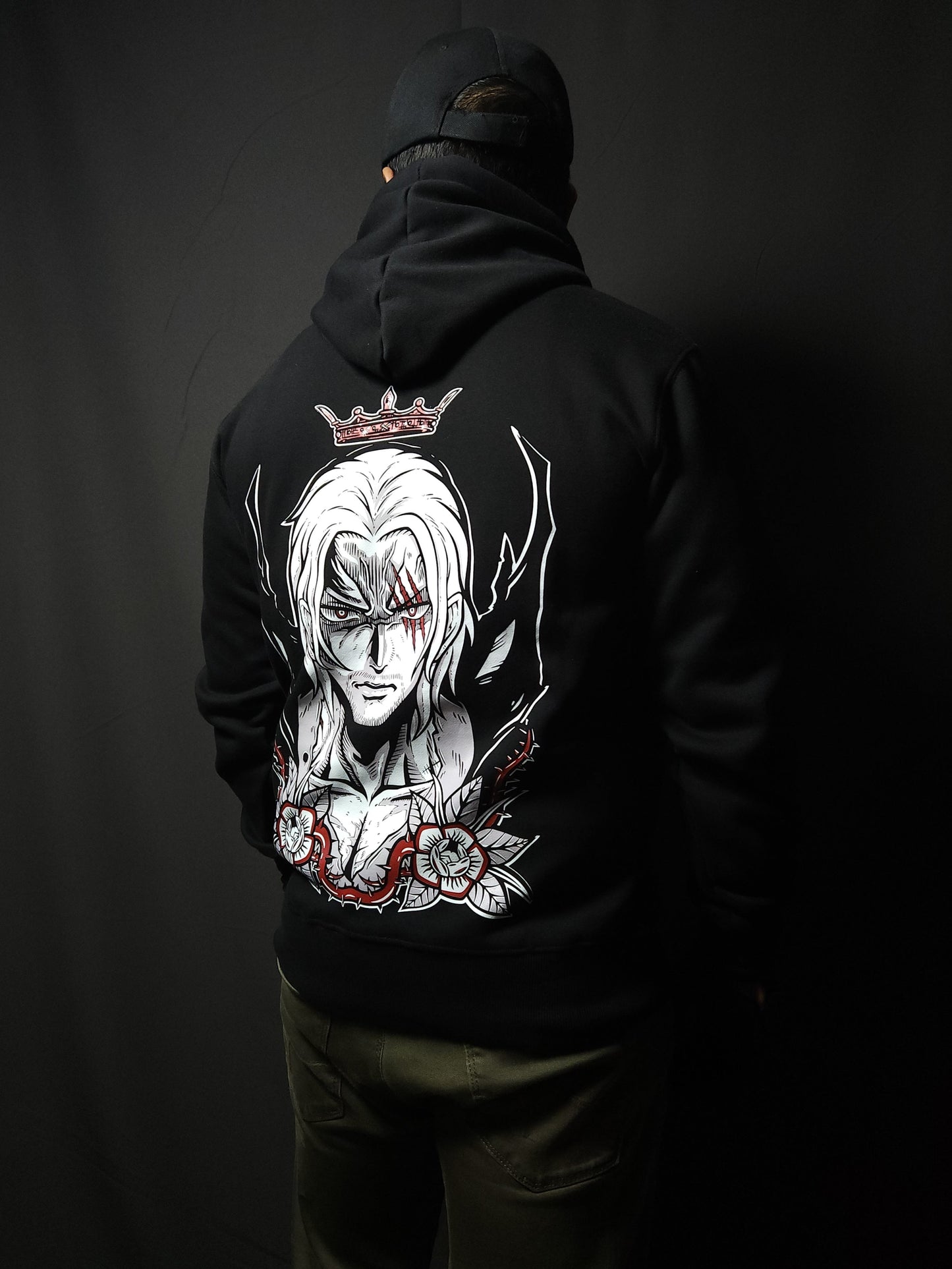 Anime-inspired apparel featuring bold back artwork, worn by a model in a dark studio setting – from a South African anime clothing brand.