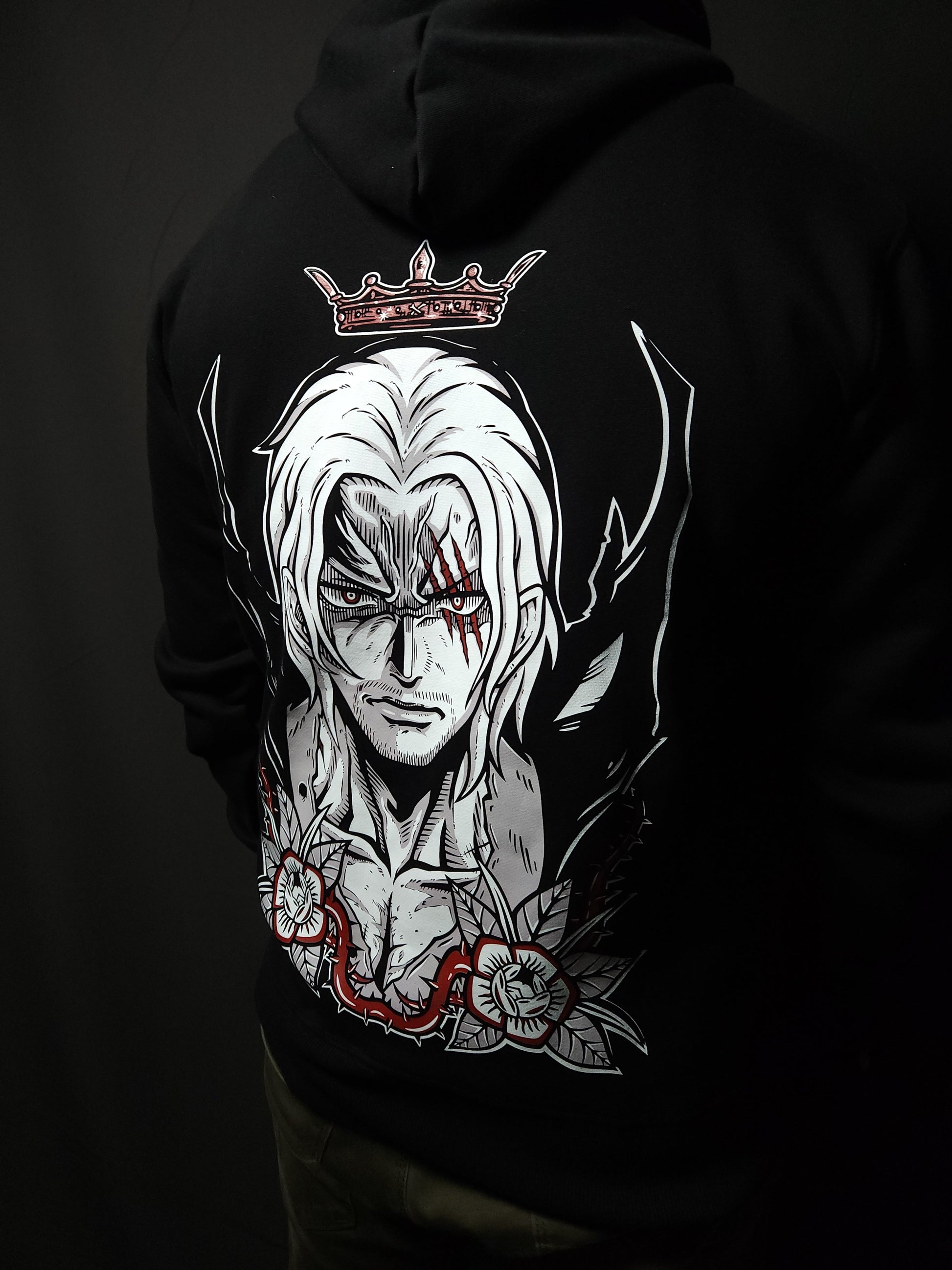 Anime-inspired apparel featuring bold back artwork, worn by a model in a dark studio setting – from a South African anime clothing brand.