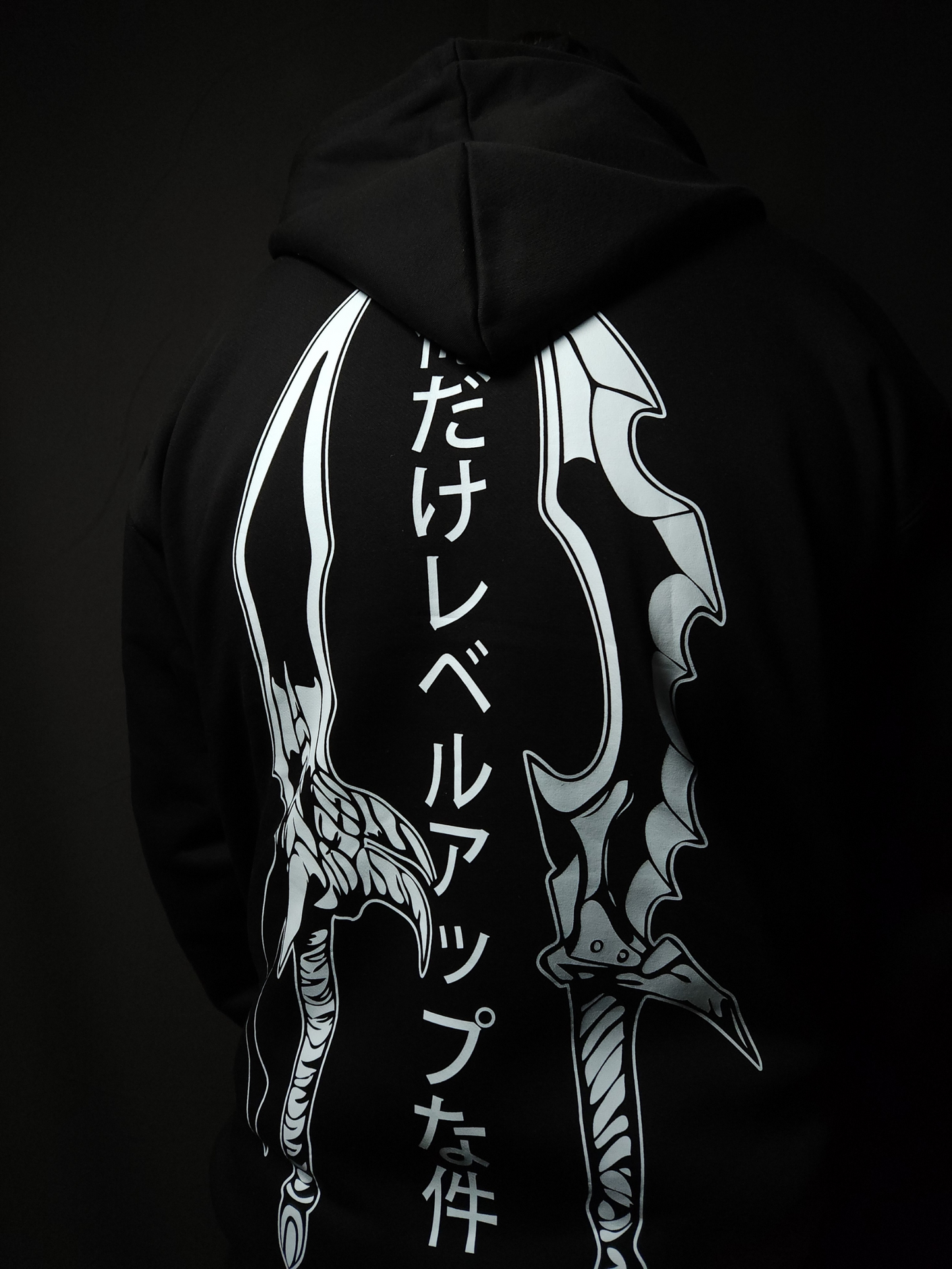 Anime-inspired apparel featuring bold back artwork, worn by a model in a dark studio setting – from a South African anime clothing brand.