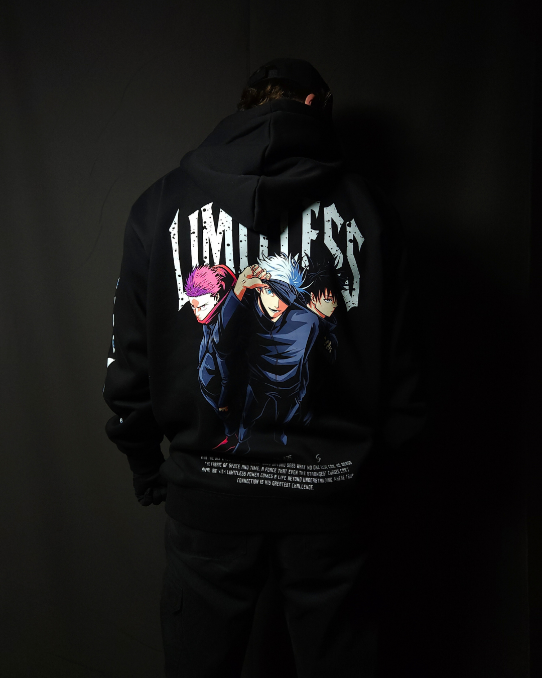 Anime-inspired apparel featuring bold back artwork, worn by a model in a dark studio setting – from a South African anime clothing brand.