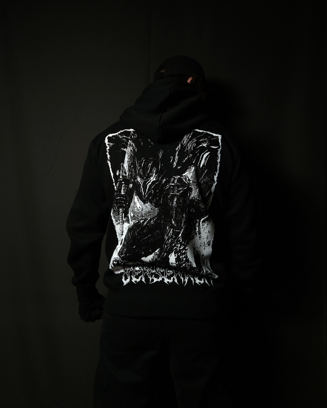 Anime-inspired apparel featuring bold back artwork, worn by a model in a dark studio setting – from a South African anime clothing brand.